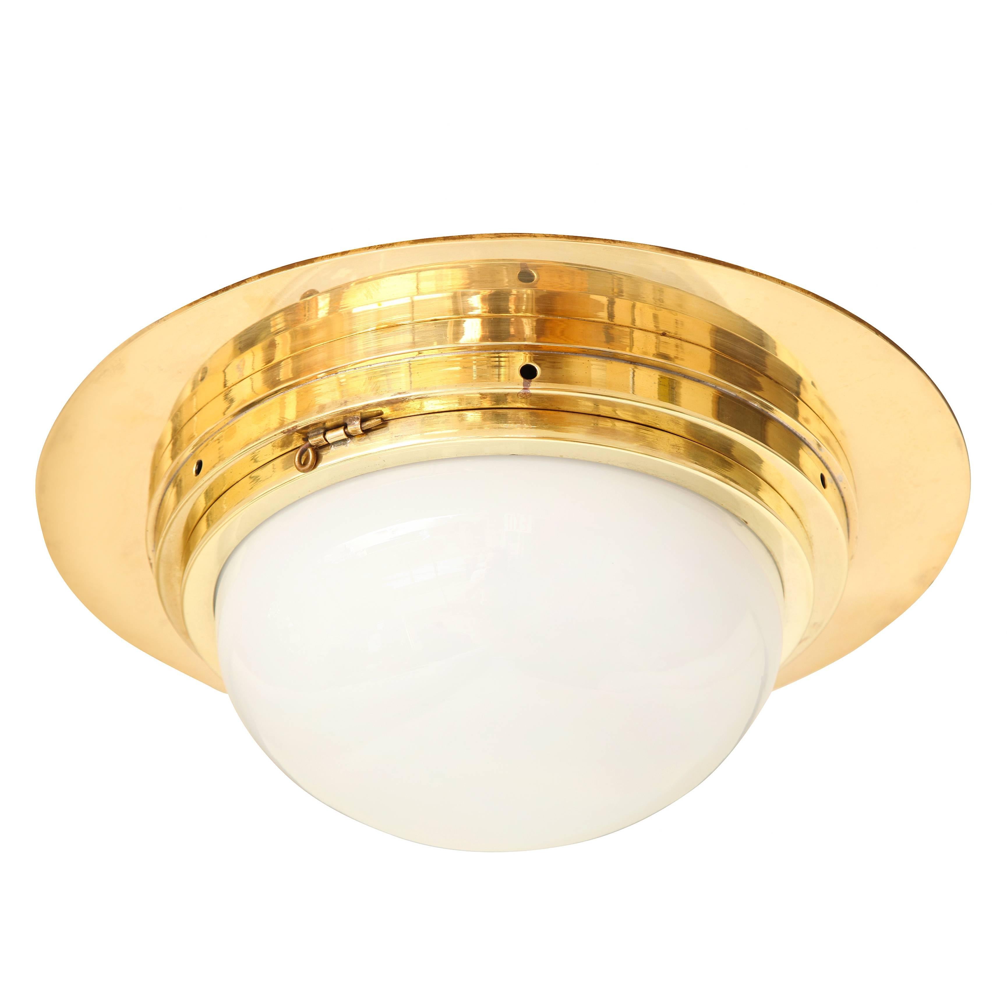 A Single Bronze Flush Mounted Fixture With Half Dome Glass