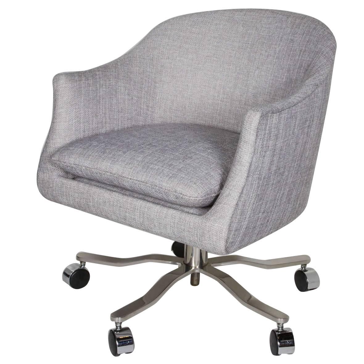 Mid-century desk chair with barrel back form. Elegant seamless shape that can swivel 360° and the height of the seat can be adjusted via the corkscrew centre rod. Upholstered in an elegant light grey woven fabric, with removable seat cushion. The