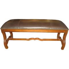 Leather and solid carved wood frame bench with nail-head detail