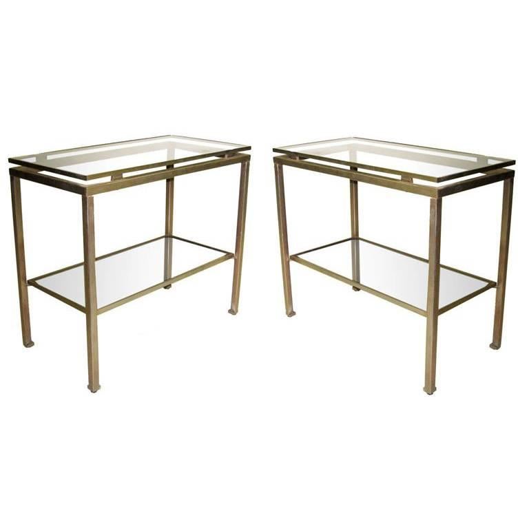 1 French Mid-Century Modern end / side table/ nightstand in nickeled steel with glass tops by Guy Lefevre for Jansen. Elegant double level table with cantilevered top and sleek tapered legs. 1 Table is available (not a pair).

