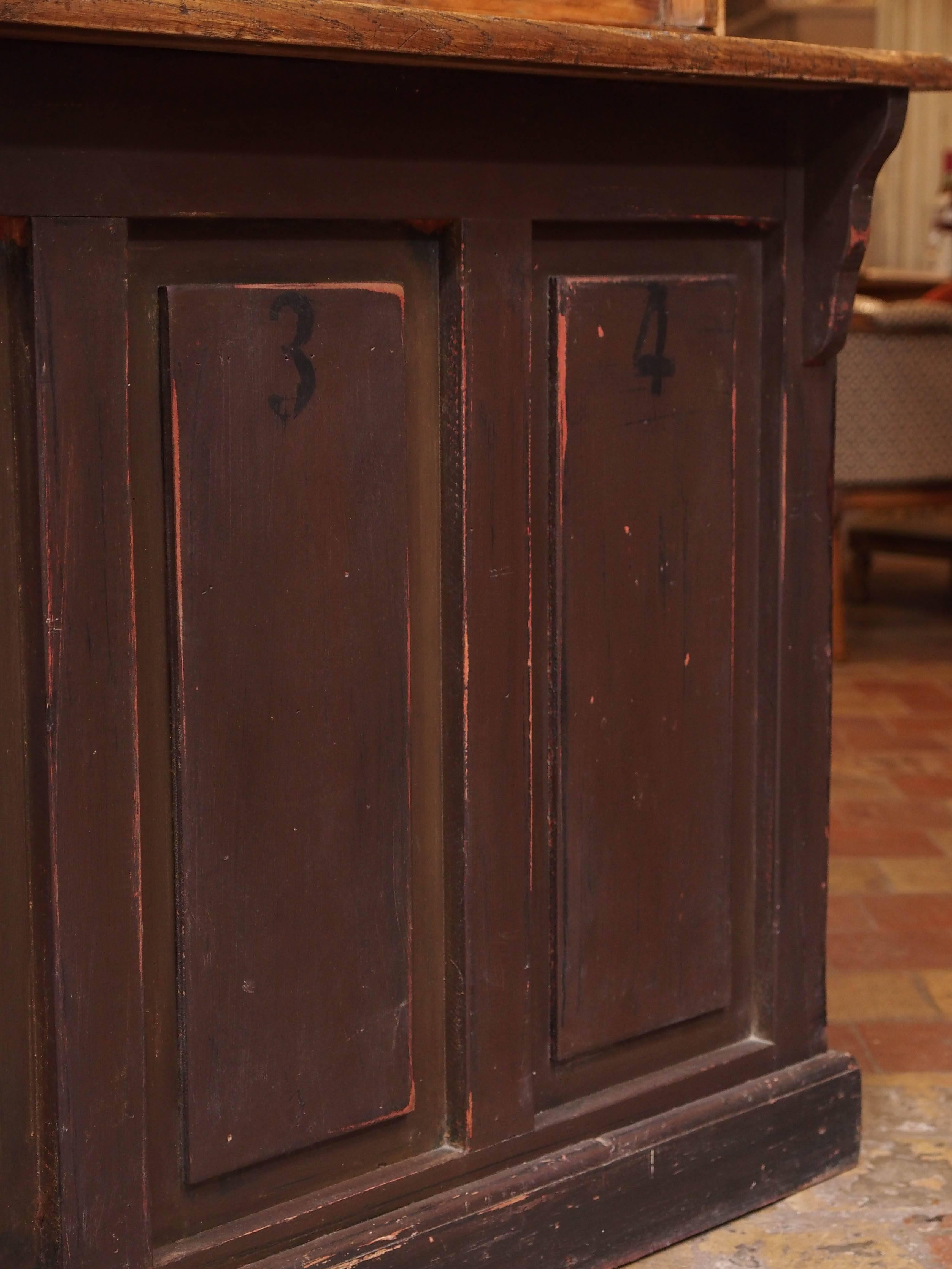 French painted wood post office counter with 19th century antique glass windows. The bottom counter was made later. This would make a wonderful room divider, used as a bar, bathroom with double sinks or in a kitchen used as server and storage. The