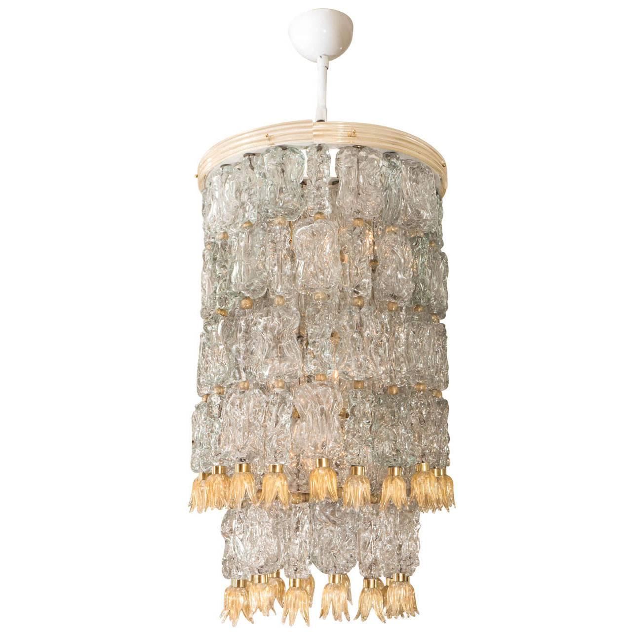 Tiered chandeliers composed of textured glass elements