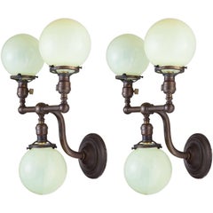 Pair of Brass and Vaseline Glass Three Globe Sconces, circa 1920