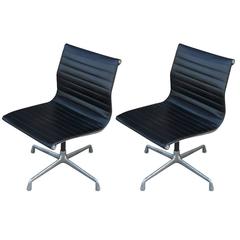 Two Eames Aluminum Group Chairs 