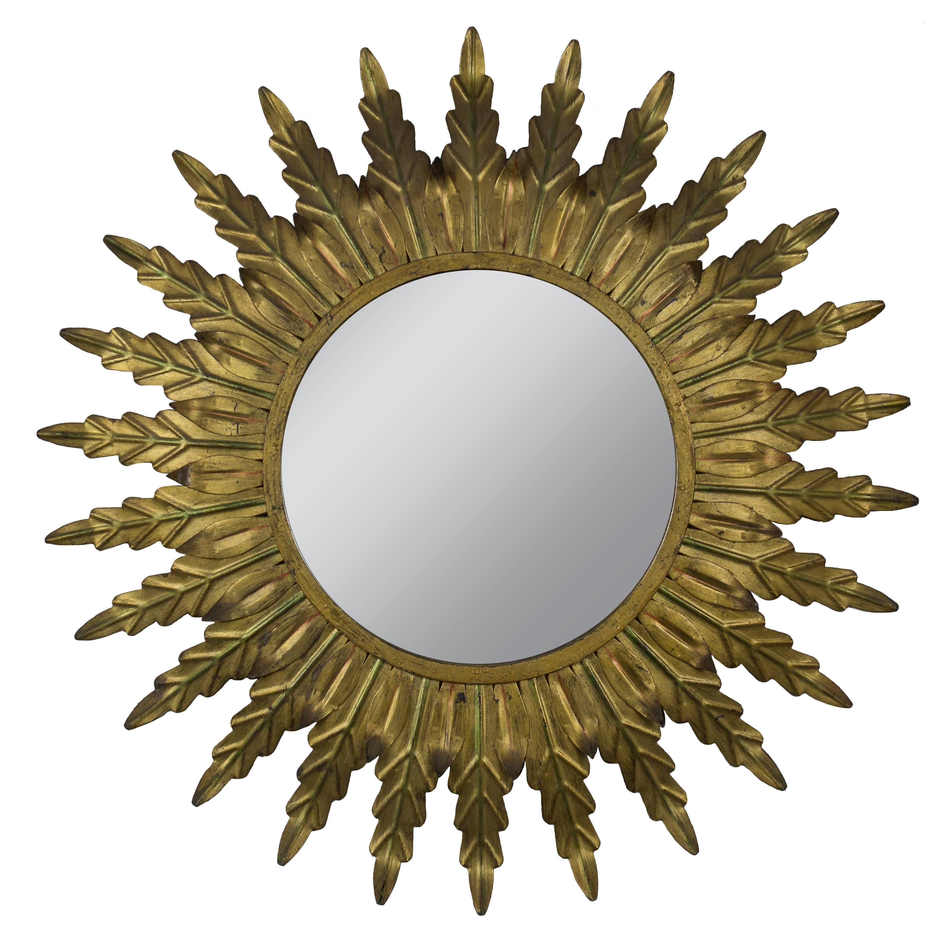 Gilt Metal Sunburst Mirror with Radiating Leaves and Traces of Green Hues