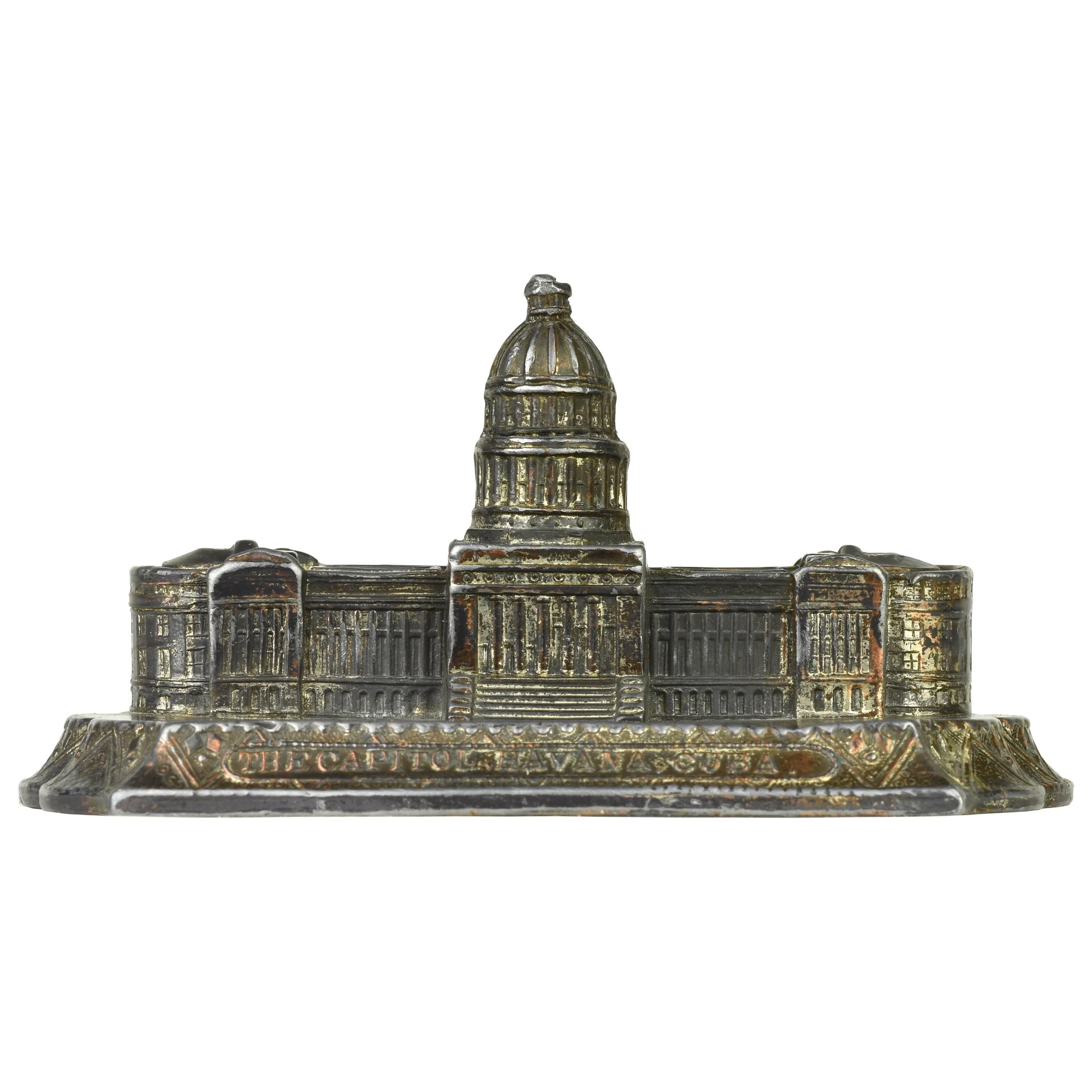 Havana Capitol Building, 1930s architectural souvenir model.

From Piraneseum's Attic, a 1930s, silver-plated lead replica of the Capitol in Havana, Cuba. 

Patterned after the Capitol Building in Washington, DC and built in 1926, the building