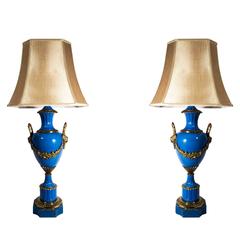 Antique Pair of Porcelain Lamps with Brass Design