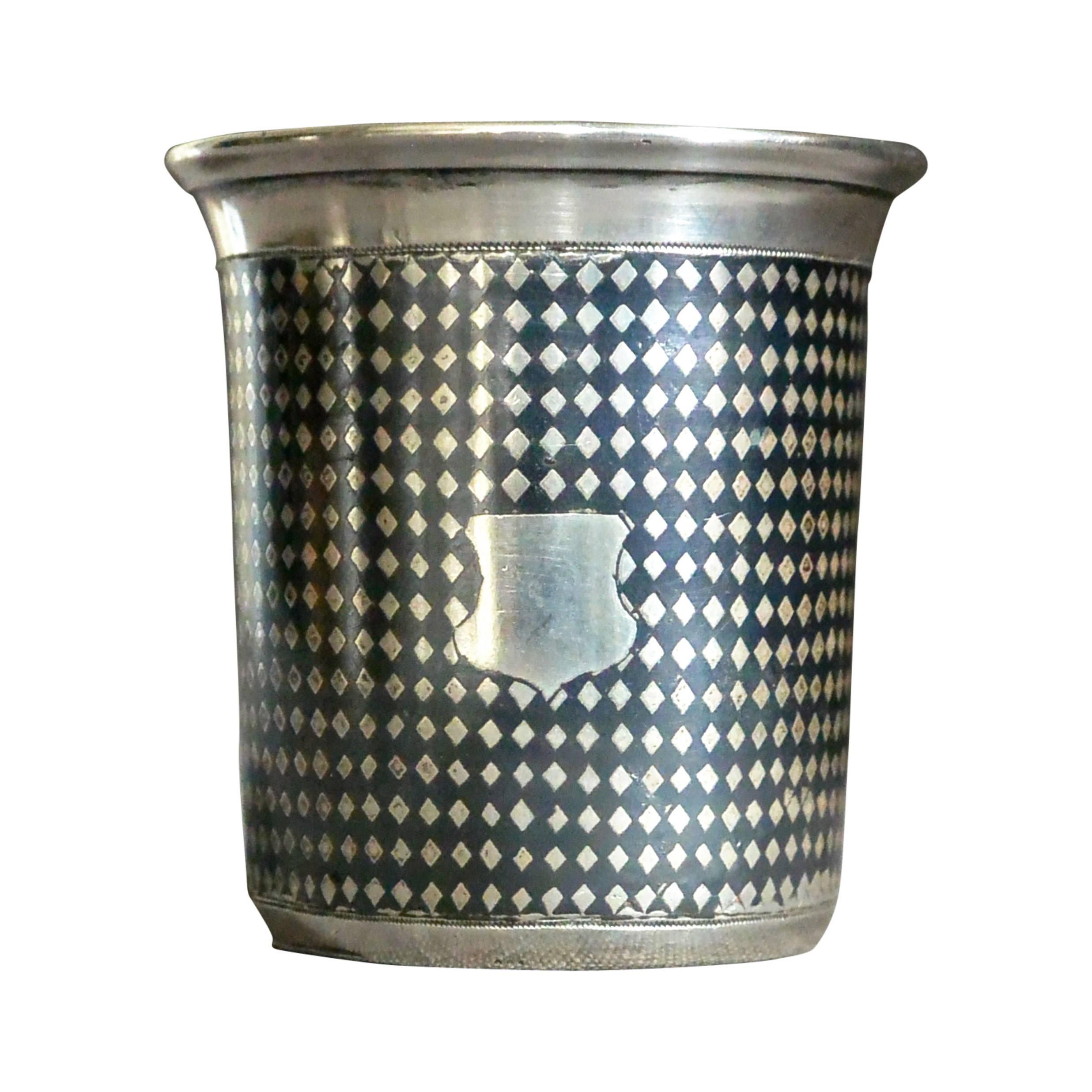 Russian silver and niello beaker. Heavy sterling silver presentation cup with niello diamond pattern and blank cartouches. With hallmarks and stamped TA and KA 1859 and 84. Russia, circa 1859
Dimension: 2.5