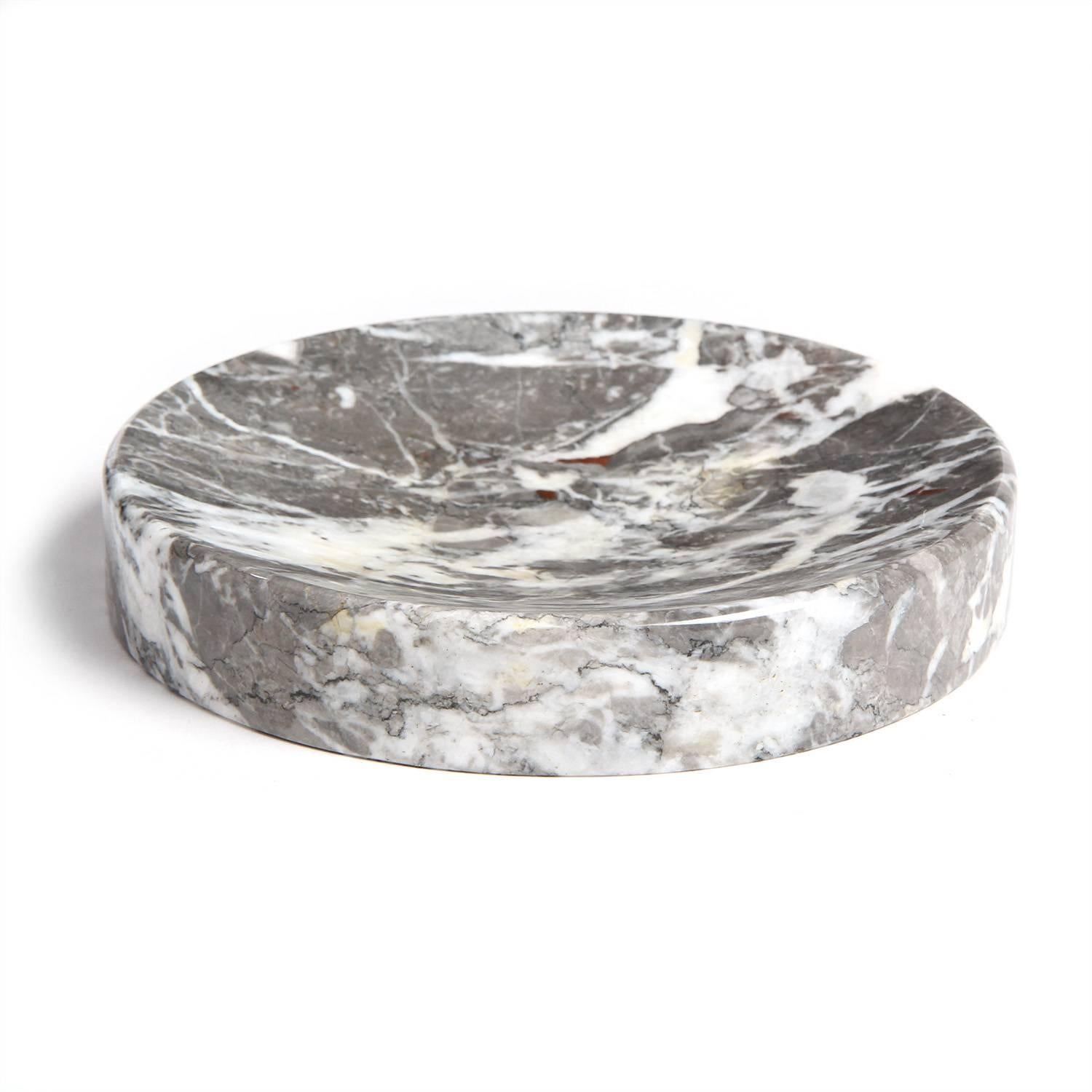 A masterfully rendered shallow bowl crafted of vividly figured grey and cream marble.