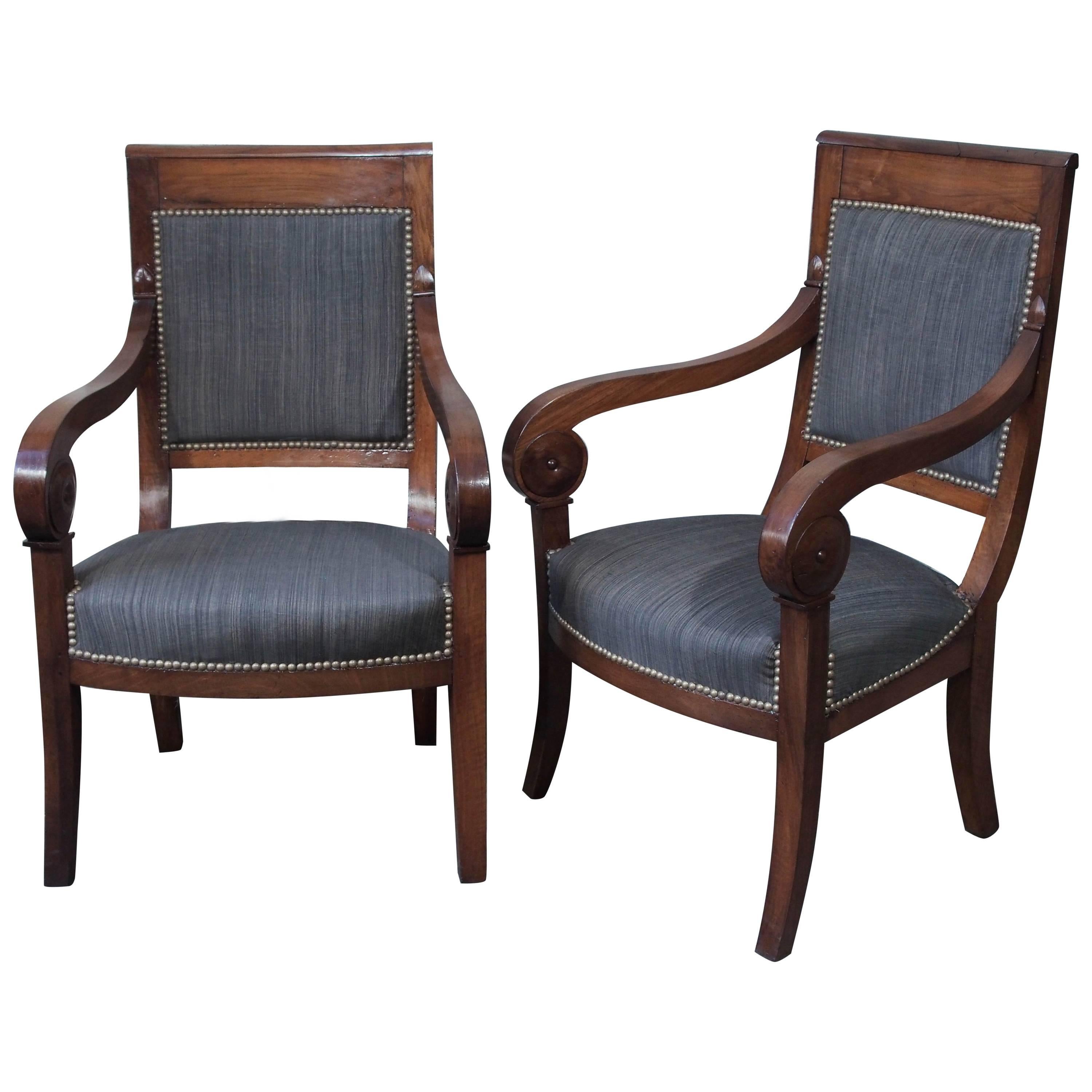 Pair of French Restauration Period Walnut Fauteuils with Scroll Arms