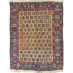 Rare tapis Shirvan caucasien ancien à fond jaune et bordure bleue