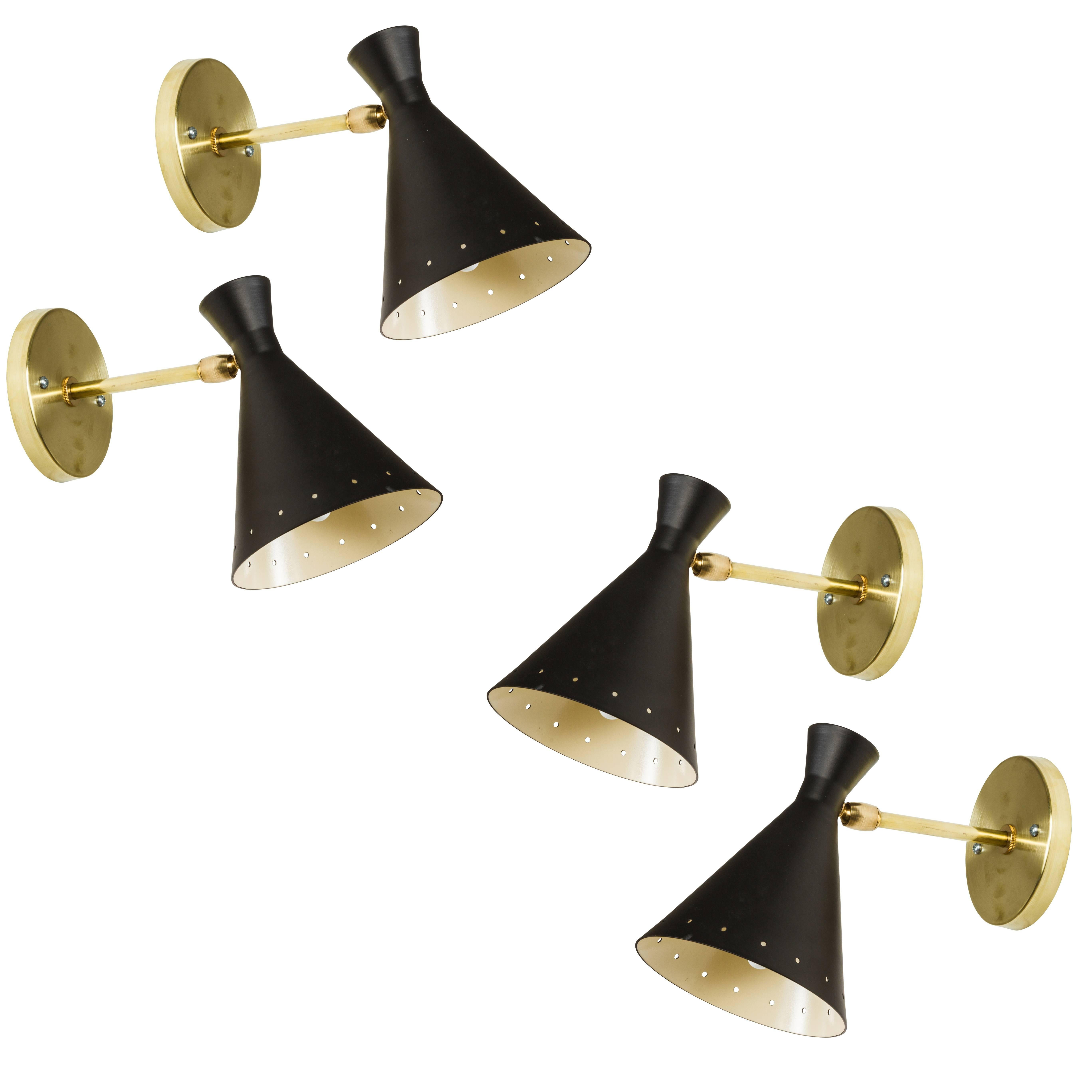 Petite Italian sconce in the style of Stilnovo. Executed in brass, black painted metal and custom brass backplate for US. 

Not UL listed, but available from authorized 3rd party vendor upon request for an additional fee. Please contact dealer to