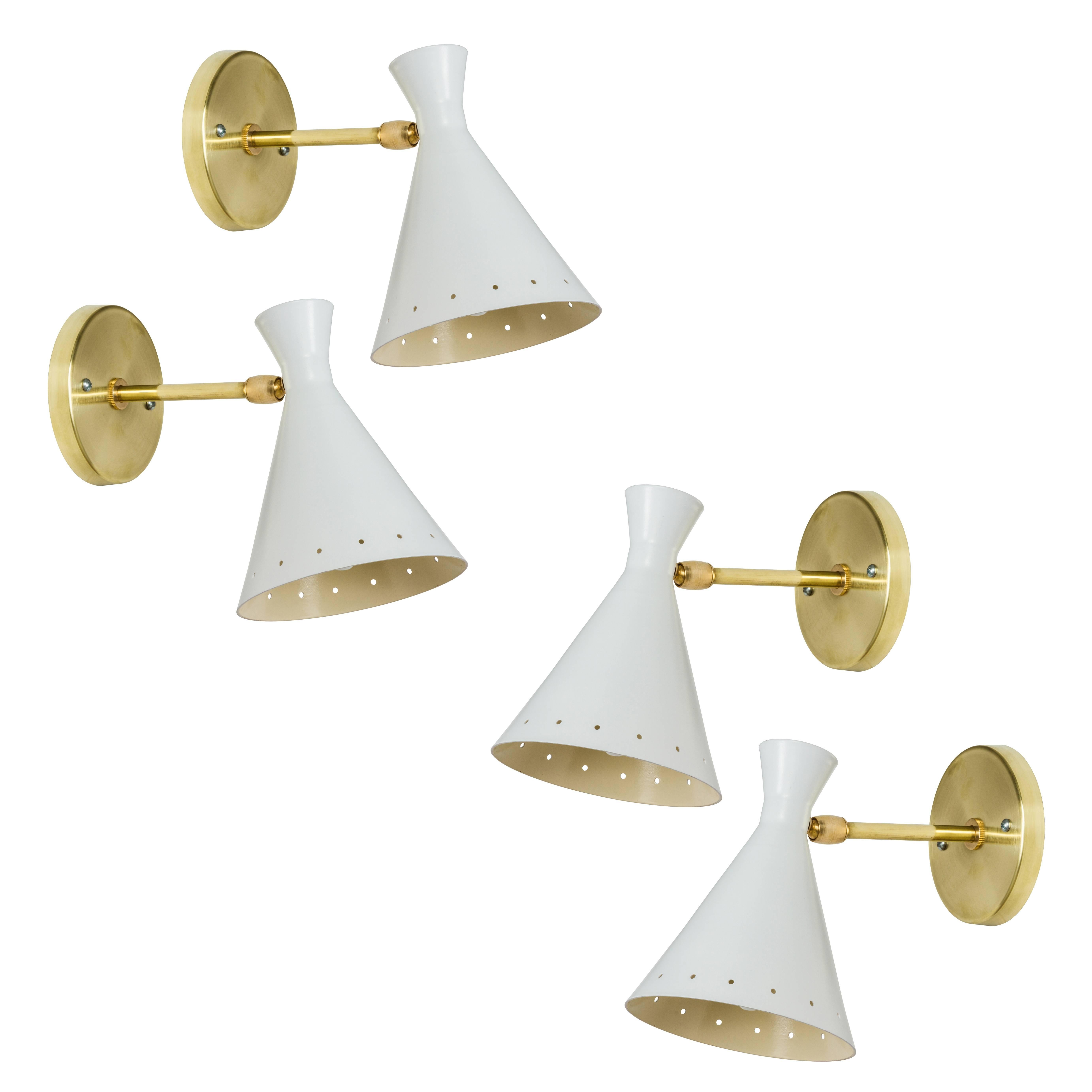 1950s Petite Italian sconces attributed to Stilnovo. Executed in brass, white painted metal and custom brass back plate for US.
Sold as a single set or in pairs.