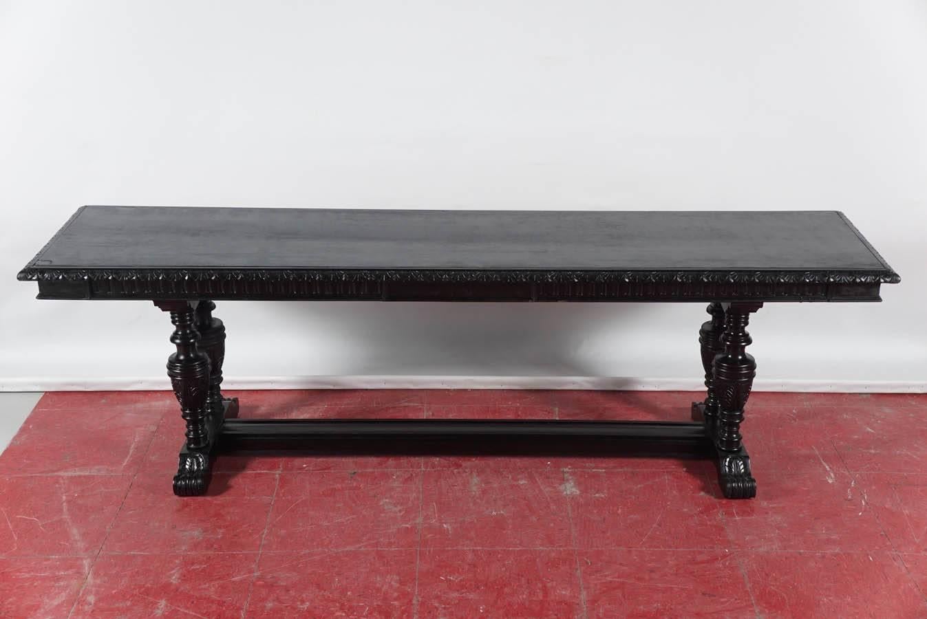 The handsome late 19th-early 20th century bench has four legs turned to resemble urns and also has scroll feet and a stretcher.