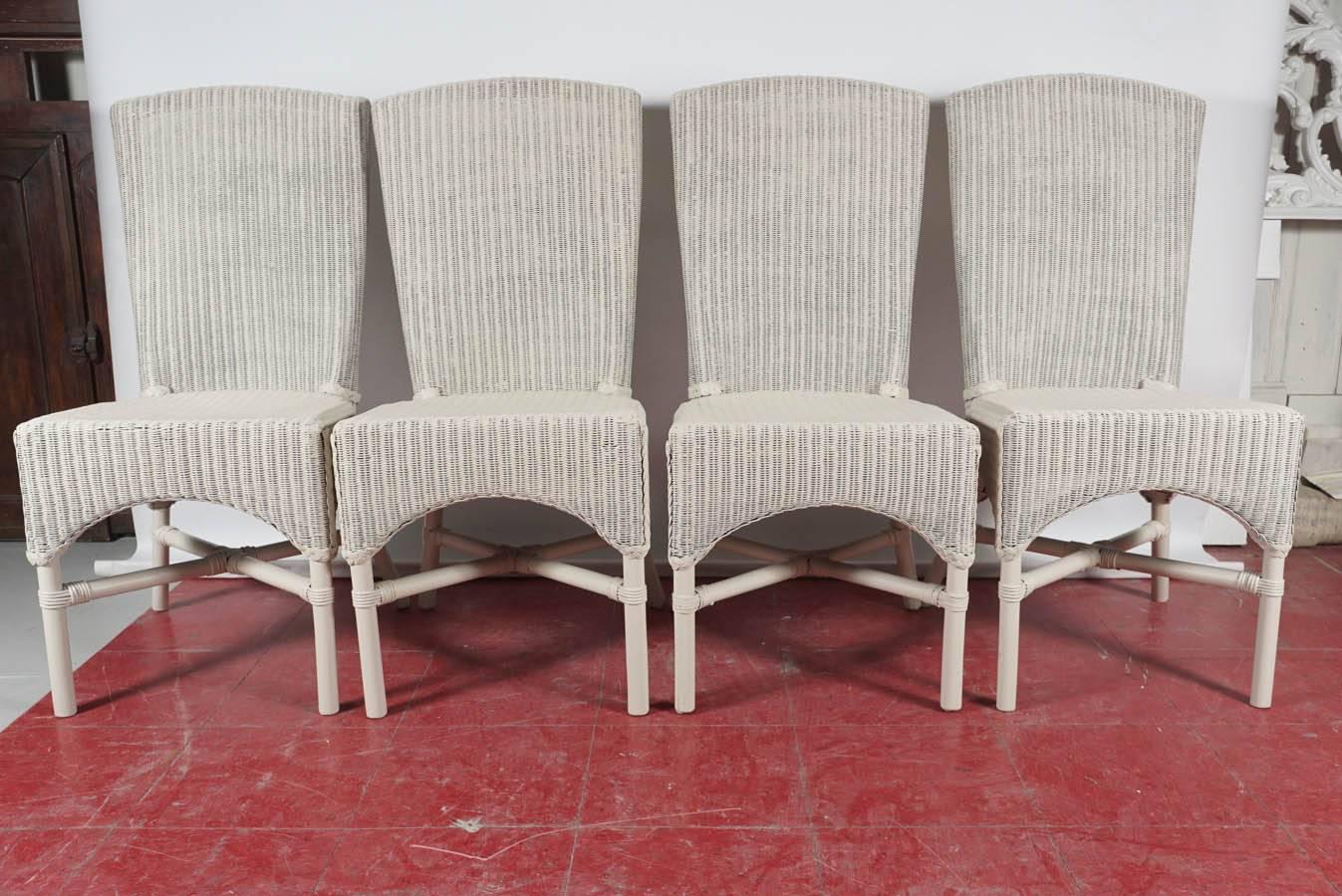 This set of 6 (only 4 shown) wicker like chairs are vintage Lloyd Loom which refers to a process invented in 1917 by the American Marshall B. Lloyd, who twisted kraft paper round a metal wire, placed the paper threads on a loom and wove them into