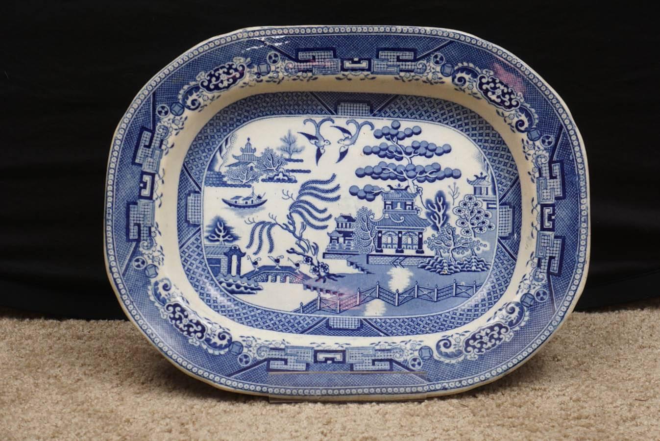 Elegant and appealing, this large platter depicts outdoor scenes of Japan, a frequent theme of artists of this period. The platter shows the appropriate wear one would expect on a piece of this age; there are no repairs or cracks. Great on a wall or