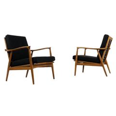 Pair of beautiful scandinavian Mid Century sculptural walnut Easy Chairs 1960s