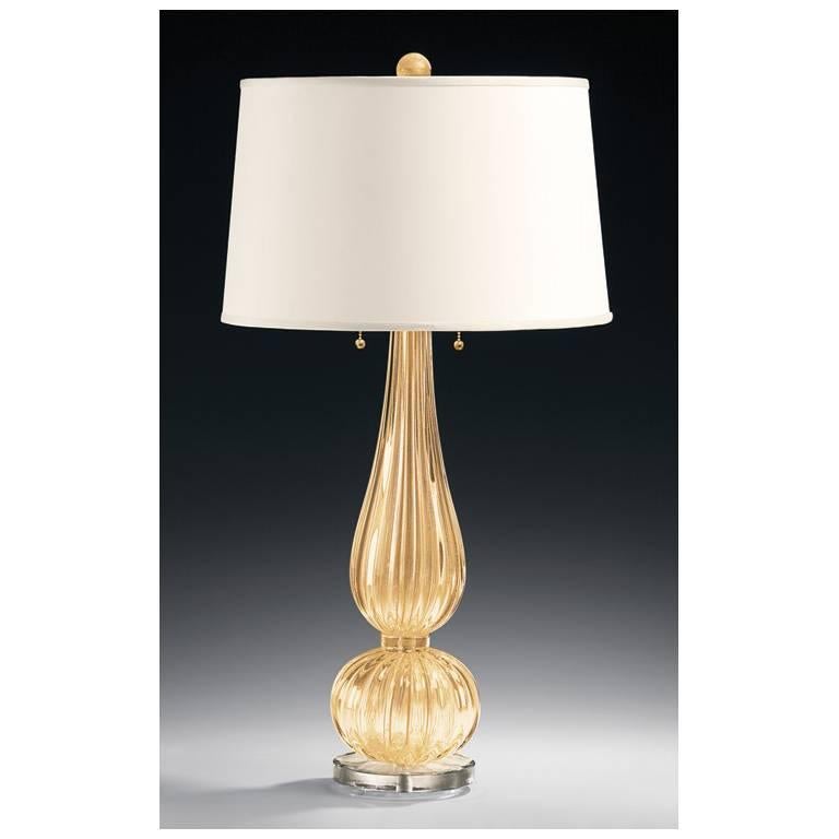 Venetian glass lamp
handblown clear and gold
Round
Two lights
Measures: Hardback fabric shade 16