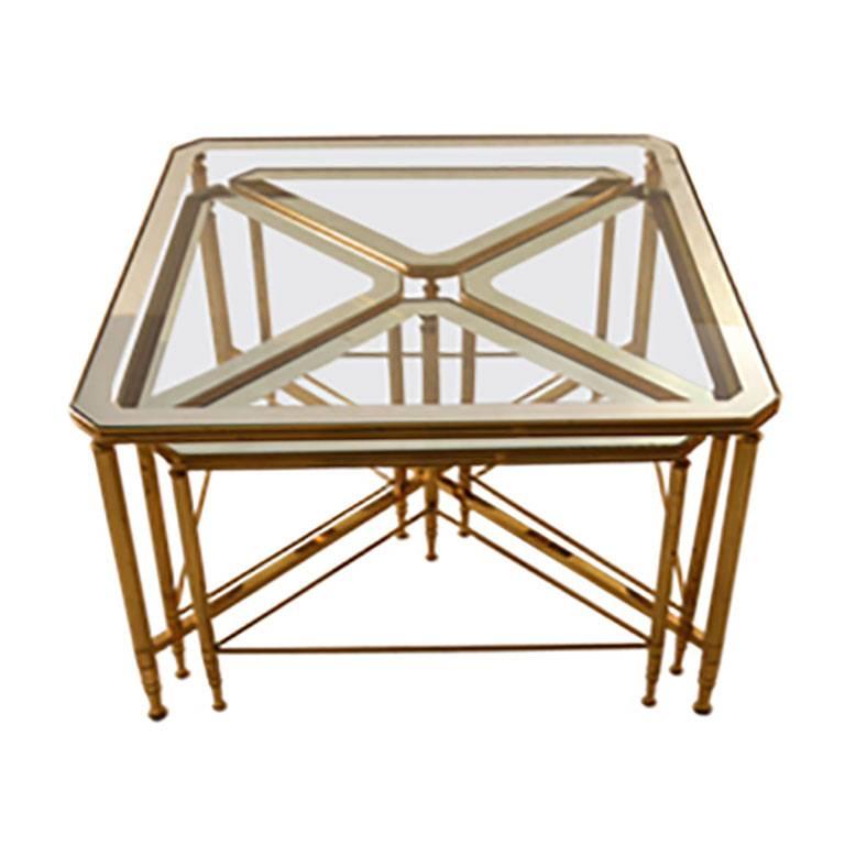 Five piece nesting tables brass frames with mirrored tops