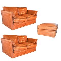 Pair of Leather Sofas and Ottoman