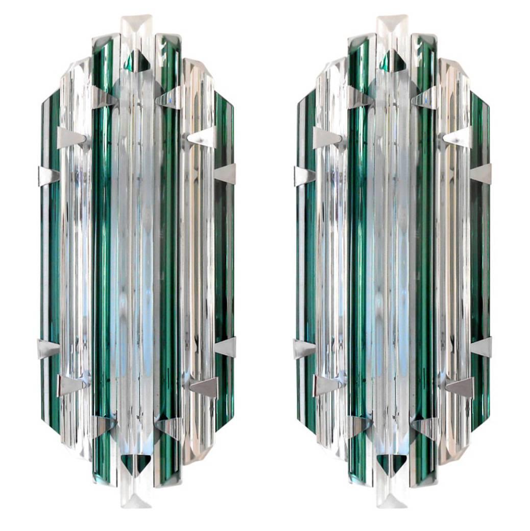 Unique Venini Triedri emerald and clear crystal sconces. 
Each sconce has two candelabra sockets, newly rewired for US. 
Chrome hardware to mount crystals to white metal backplate.
Set of 10 available. Can be also be purchased individually ; price
