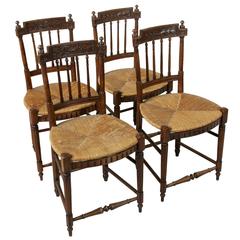 Antique Set of Four 19th Century French Directoire Style Carved Walnut Rush Seat Chairs