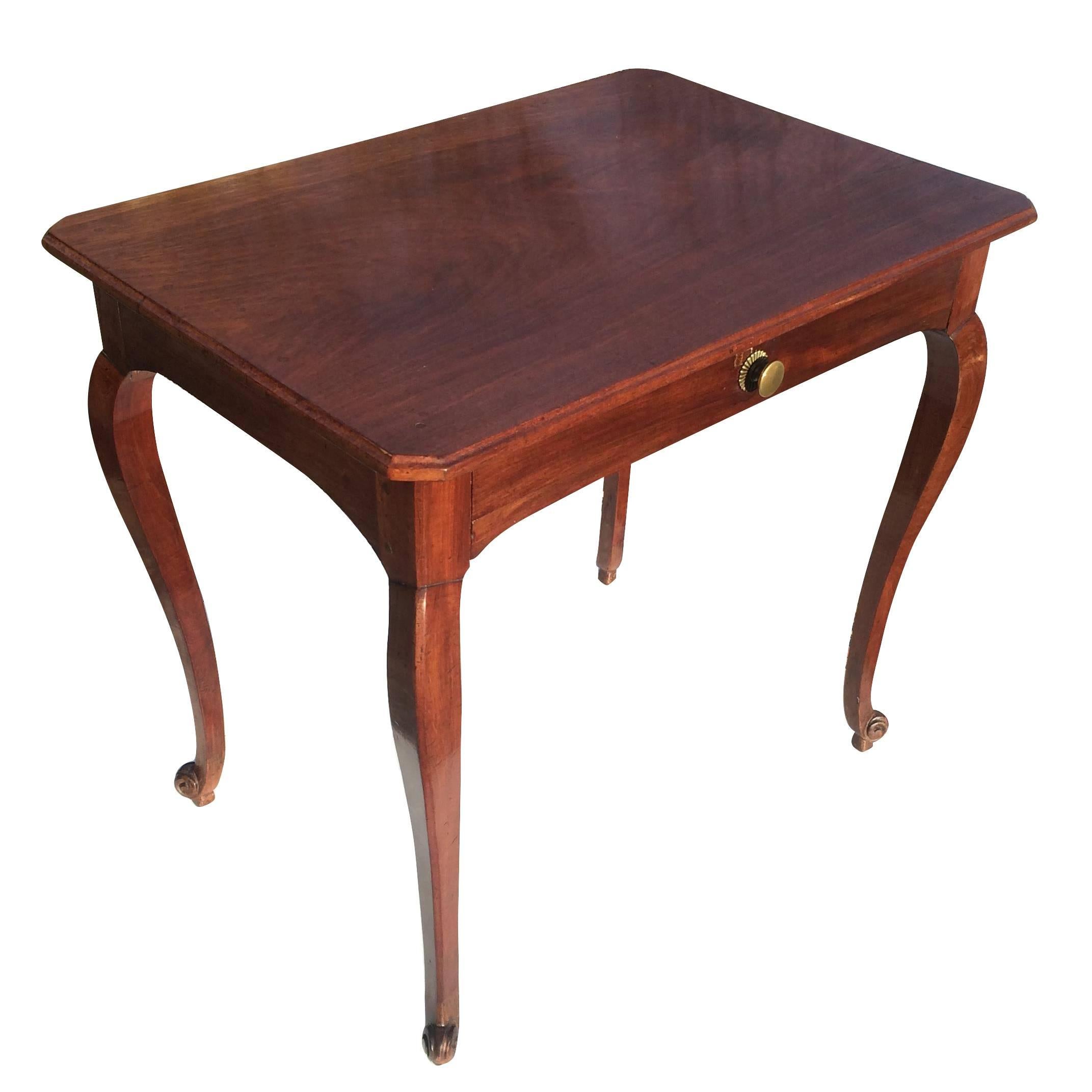 French Louis XV taste walnut writing table or side table. Chamfered corner top containing one fabric lined drawer above cabriole legs.