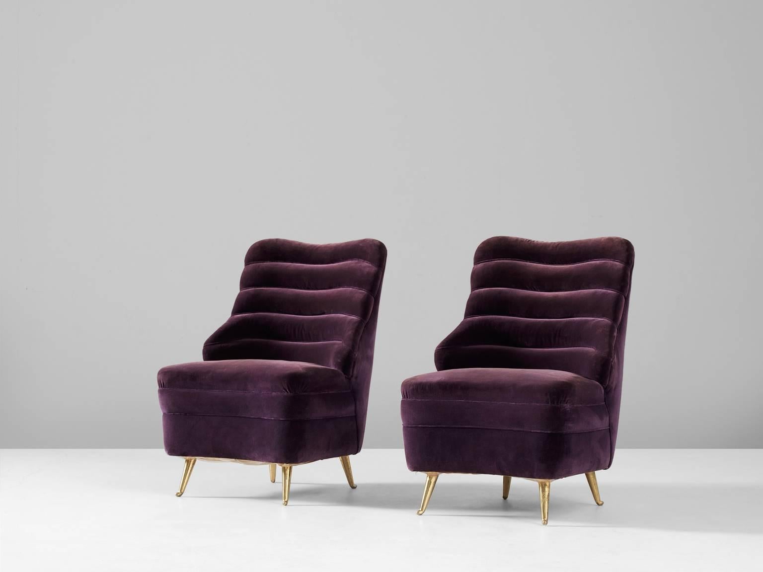 Pair of lounge chairs, in velvet and metal, by Andrea Busiri Vici, Italy, 1960s.

Elegant pair of lounge chairs in purple velvet. Organic shaped seating and back. The back of the easy chairs is layered and reminds of natural phenomenon like a sea