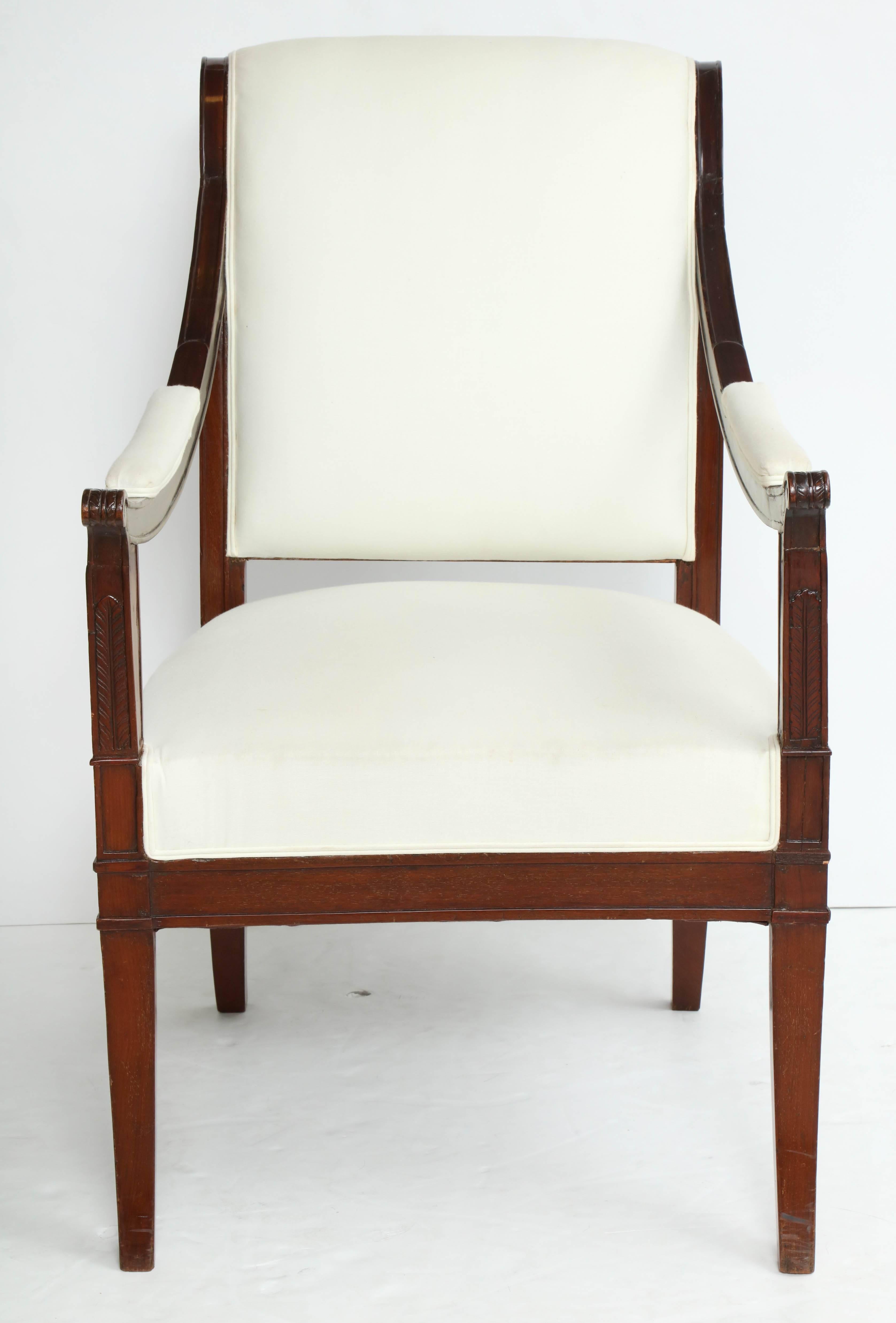 Directoire mahogany fauteuil. Tablet cresting, downswept arms, square outsplayed legs