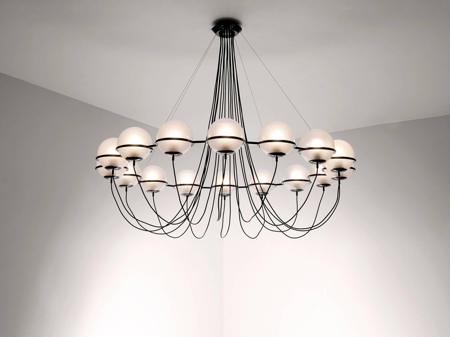 Large chandelier, in metal and glass, European 1970s.

Set of 3 chandeliers. Very large, 180 cm diameter, chandelier with 16 glass spheres. It is obvious that this design is inspired on the earlier designs of Gino Sarfatti for Arteluce, but this