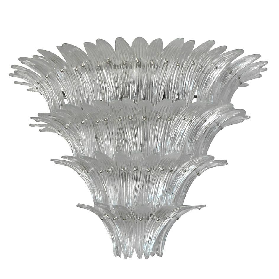 Italian chandelier shown in 140 clear Murano glass leaves mounted on 4 tiers and chrome finish metal frame
12 lights / Max 40W each
1 in stock in Palm Springs / Made in Italy