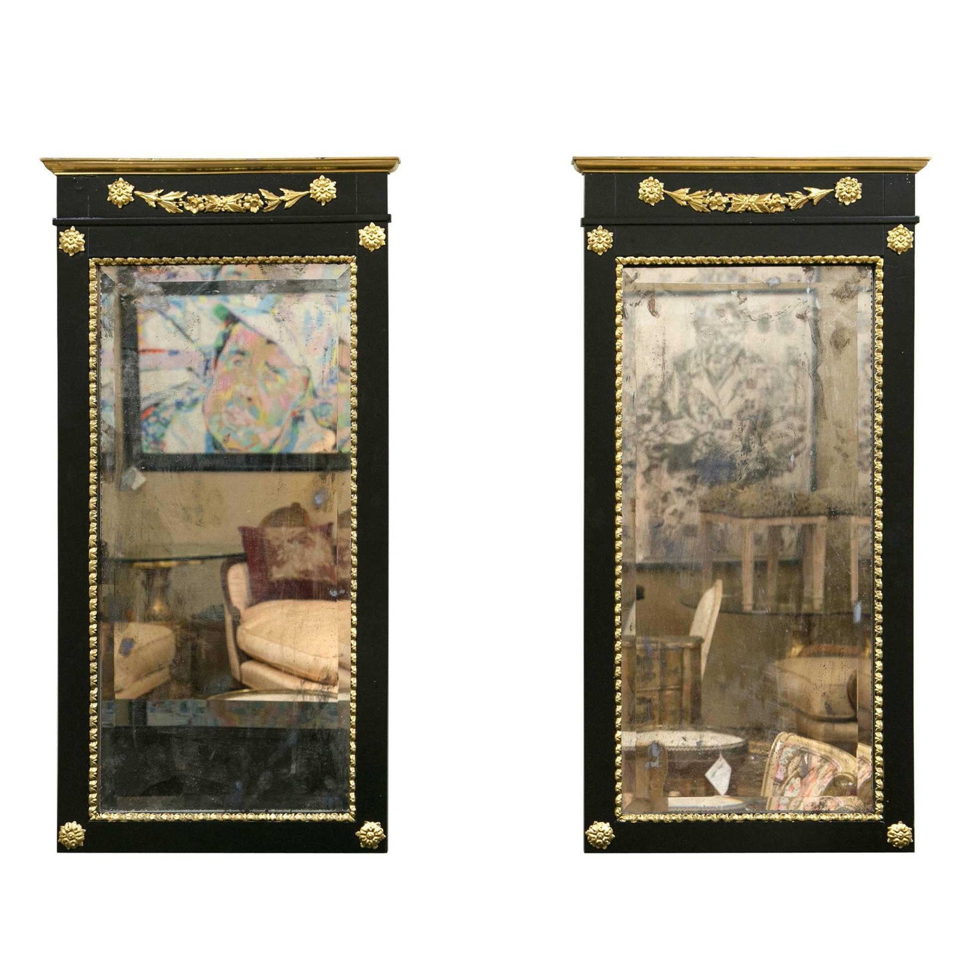 A Pair of Antique Ebony and Giltwood Wall / Console Beveled Antiqued Mirrors 