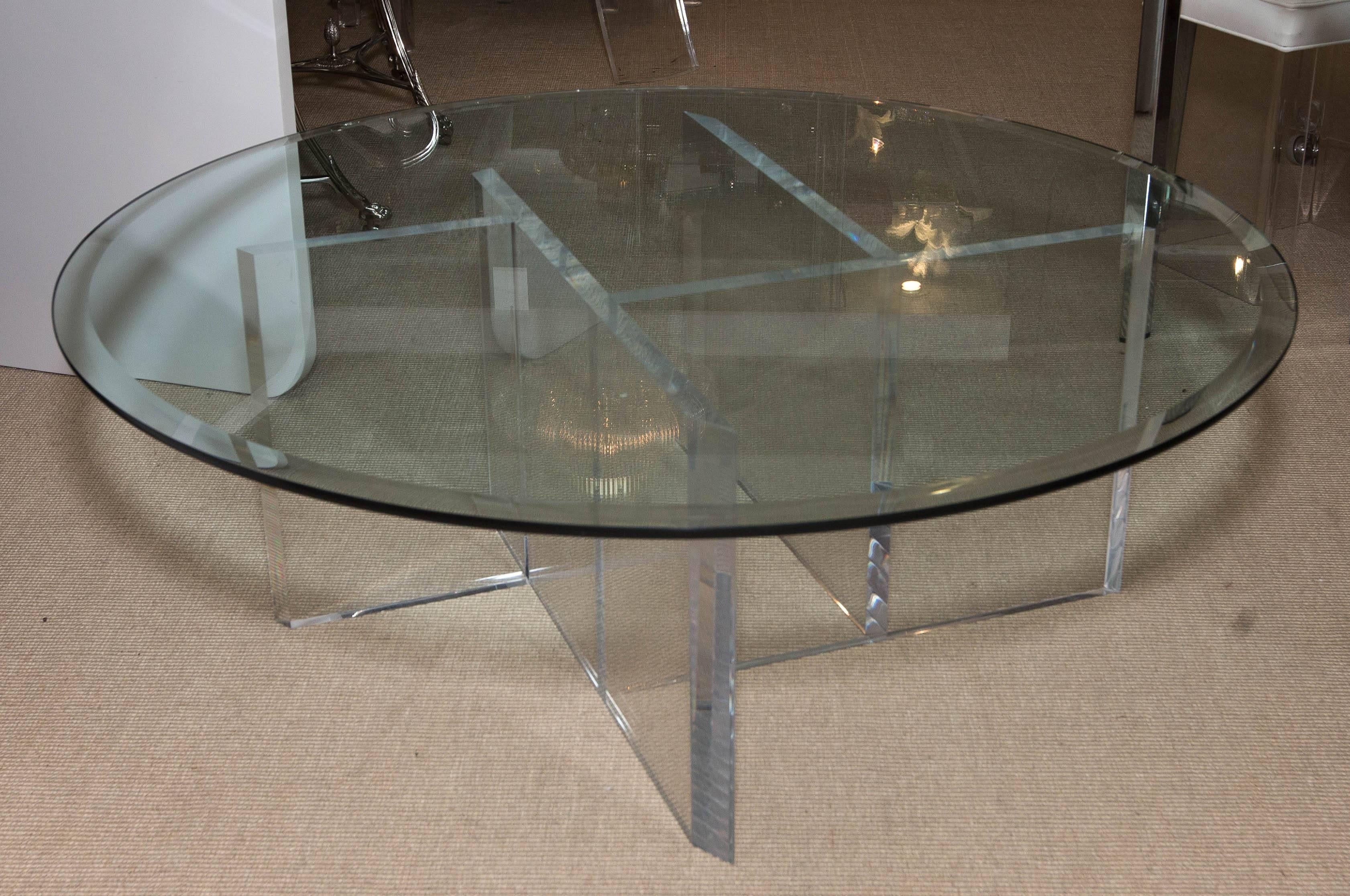 Attractive round Mid-Century Lucite cocktail table with beveled glass top.