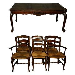 Used 19th Century French Country Carved Oak Dining Table and Chairs