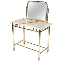 Antique An Edwardian brass dressing table with marble top, circa 1910.