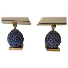 A pair of gilded and blue  of pineapple shaped ceramic lamps