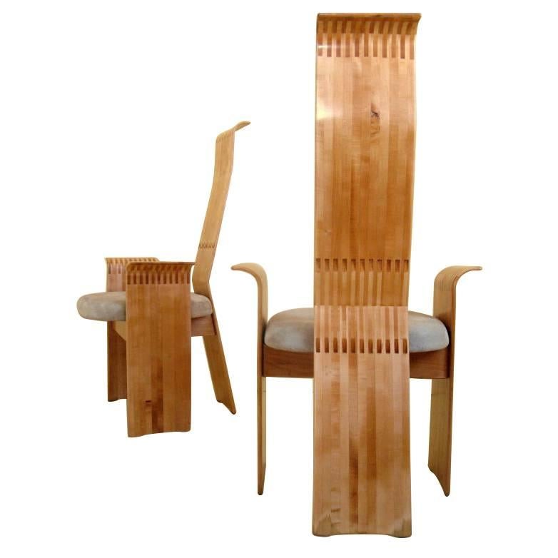 An elegant and graceful pair of commissioned maple chairs signed and dated. By the late Berthold Schwaiger (1948-2006) as part of a unique dining room suite in 1985.

Both chairs are beautifully executed and quite comfortable with their original
