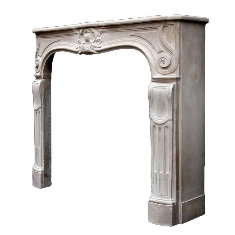 Late 18th Century French Limestone Louis XV Mantelpiece