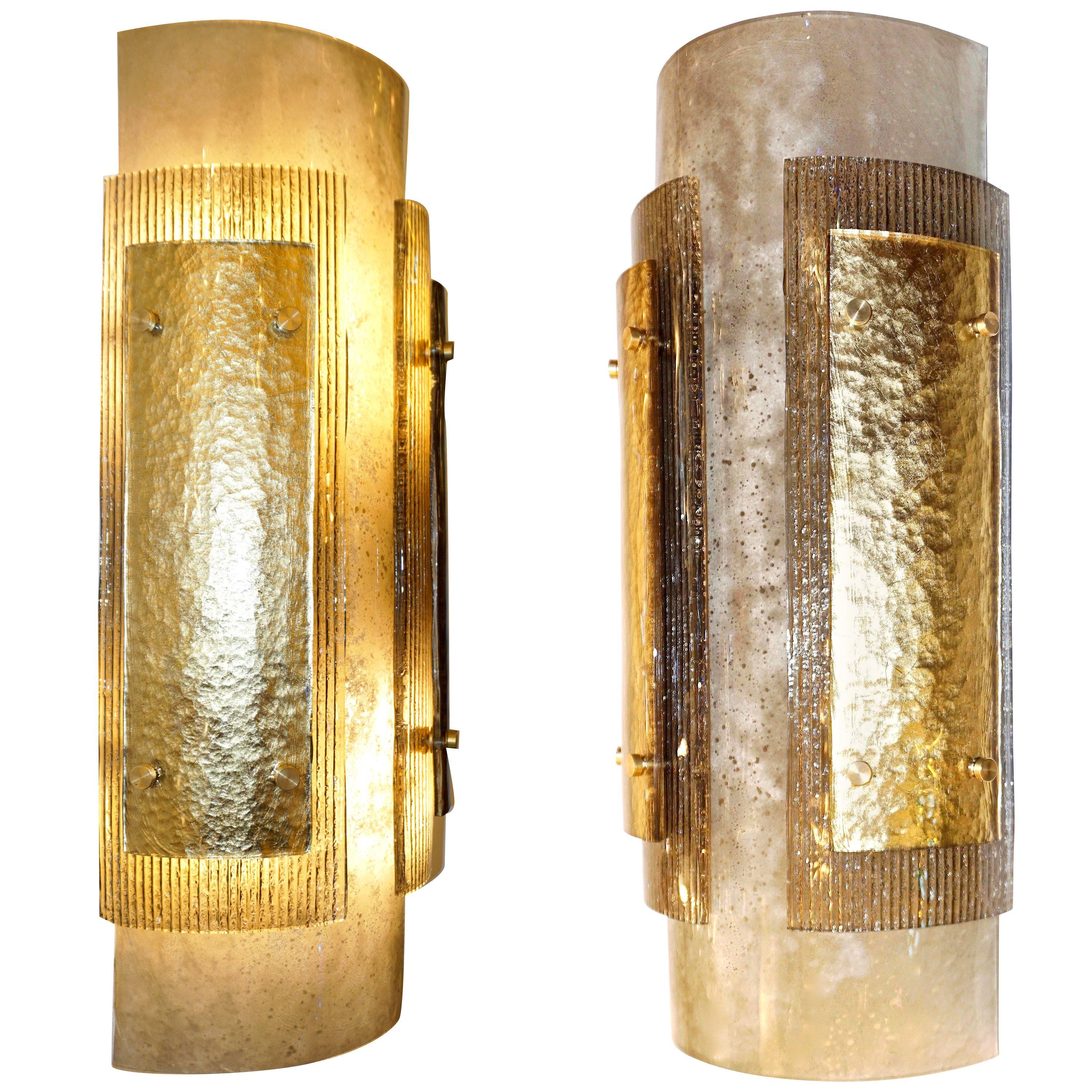 Contemporary Italian wall lights in high quality curved blown murano glass, entirely handcrafted, three different textures and colors, the frosted smoked grey body is decorated with two stepped glass layers: one with a sophisticated pattern on the