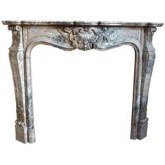 Used 19th Century Louis XV Style Beautiful Fireplace in a Soft Colored Rouge Marble
