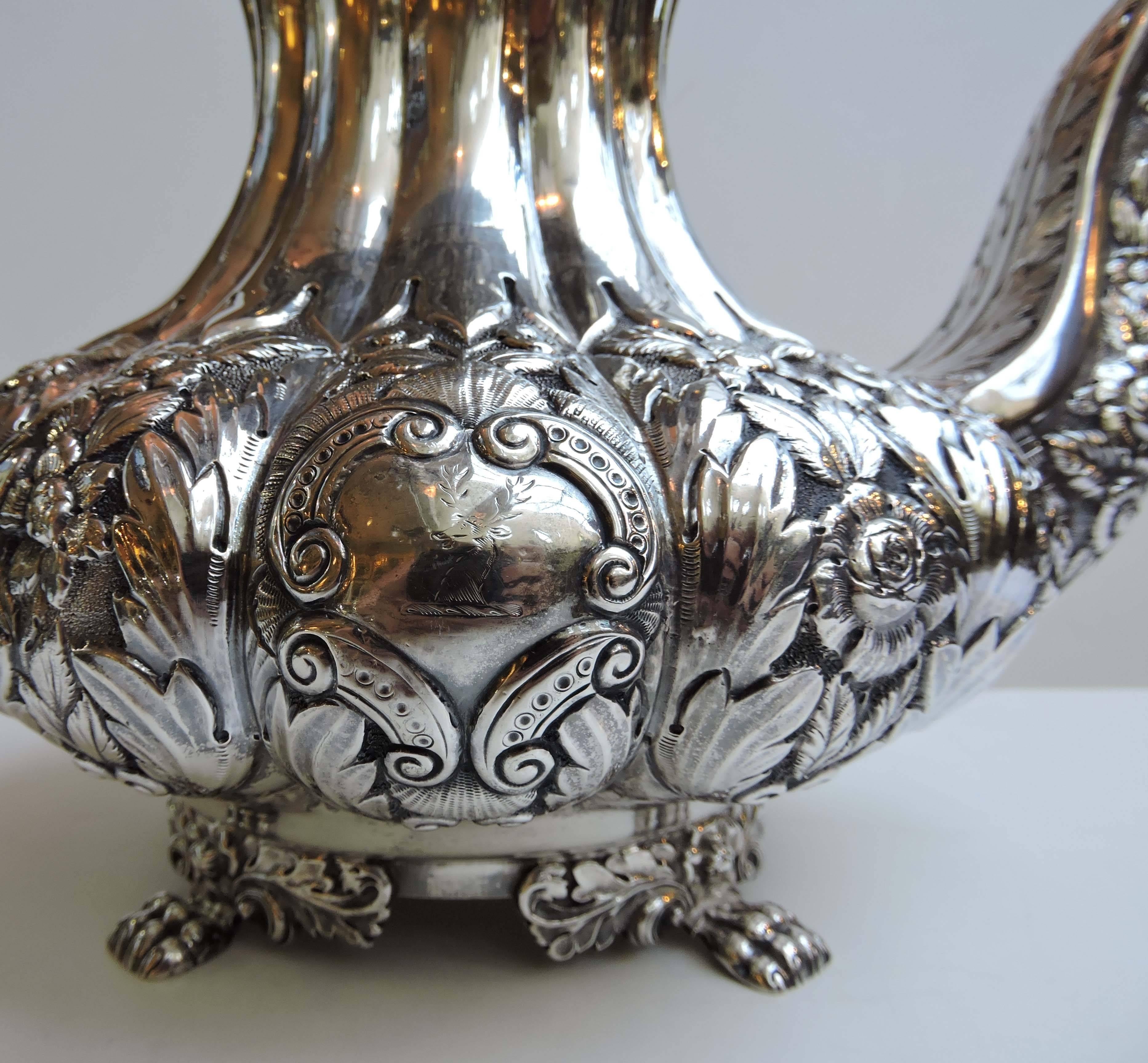 Irish four-piece sterling tea service made in Dublin, Ireland by Charles Marsh, circa 1834-1835.

Tea set consists of a melon shaped tea and coffee pot, a large open sugar and cream with ornate foliate repose, chasing and gadrooning. The lids are