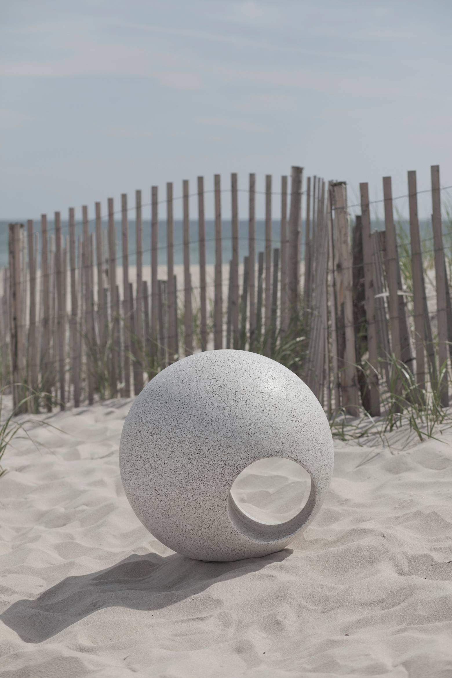 Outdoor Sphere is cast in fiberglass with stone aggregate to a look and feel like concrete or stone. This unique design is a beautiful addition to an outdoor space as a decorative sculpture or abstract seat. 

Item: Outdoor Sphere by May