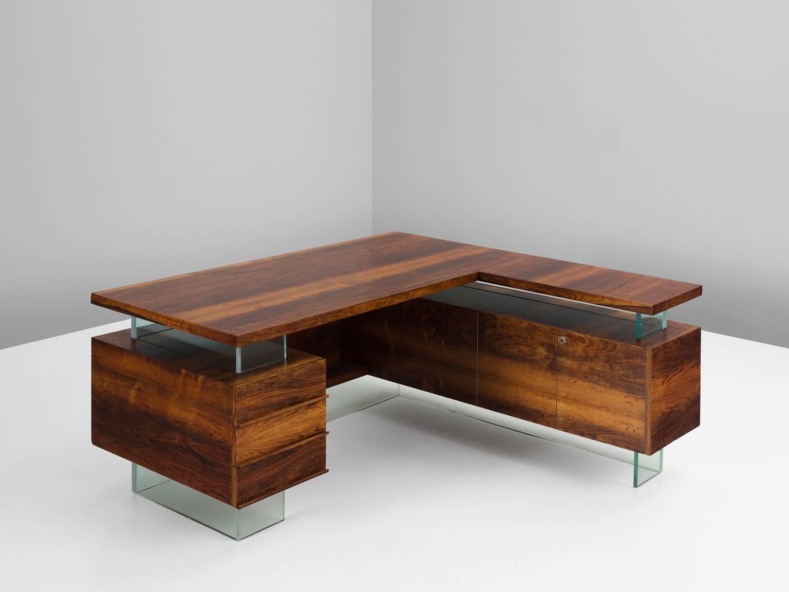 Desk in rosewood and glass, France, 1960s.

Large desk and return in Rio rosewood and glass. This desk originates from France. The wonderful design shows resemblance to the works of French designers like Rene Jean Caillette, Pierre Guariche