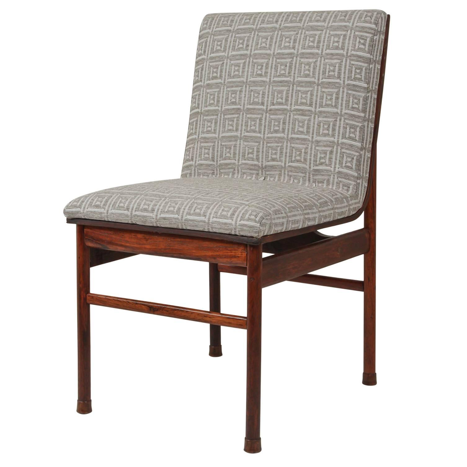 Brazilian rosewood Mid-Century dining chairs upholstered with indoor/outdoor fabric by Christopher Farr.