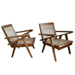 1 of 4 South Asian Teak and Cane Armchairs