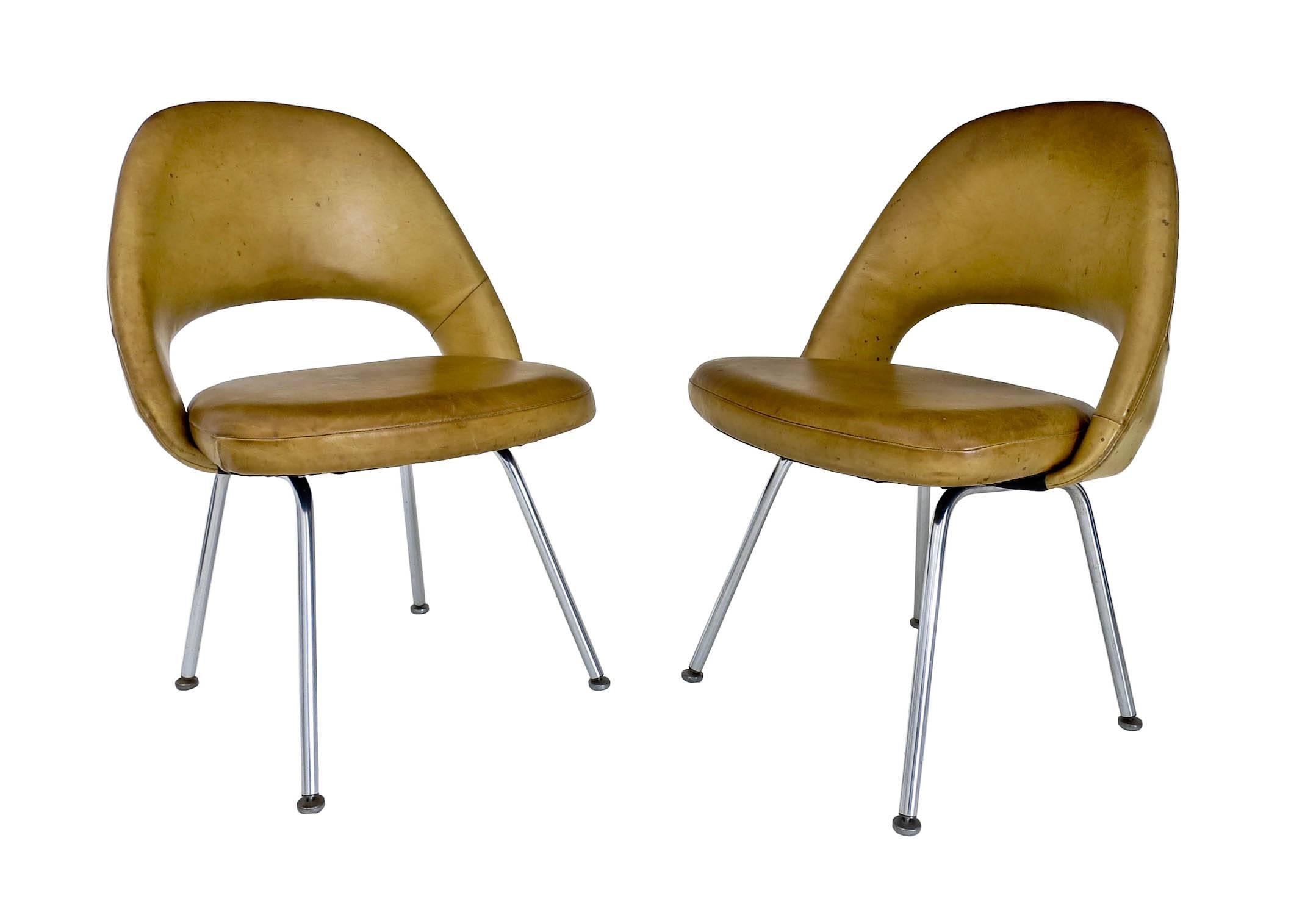 A rare pair of executive chairs designed by Eero Saarinen for Knoll International, in their original patinated leather.

Designed in 1950 these vintage chairs are very early examples, the leg configuration on the underside is a rare one, most have