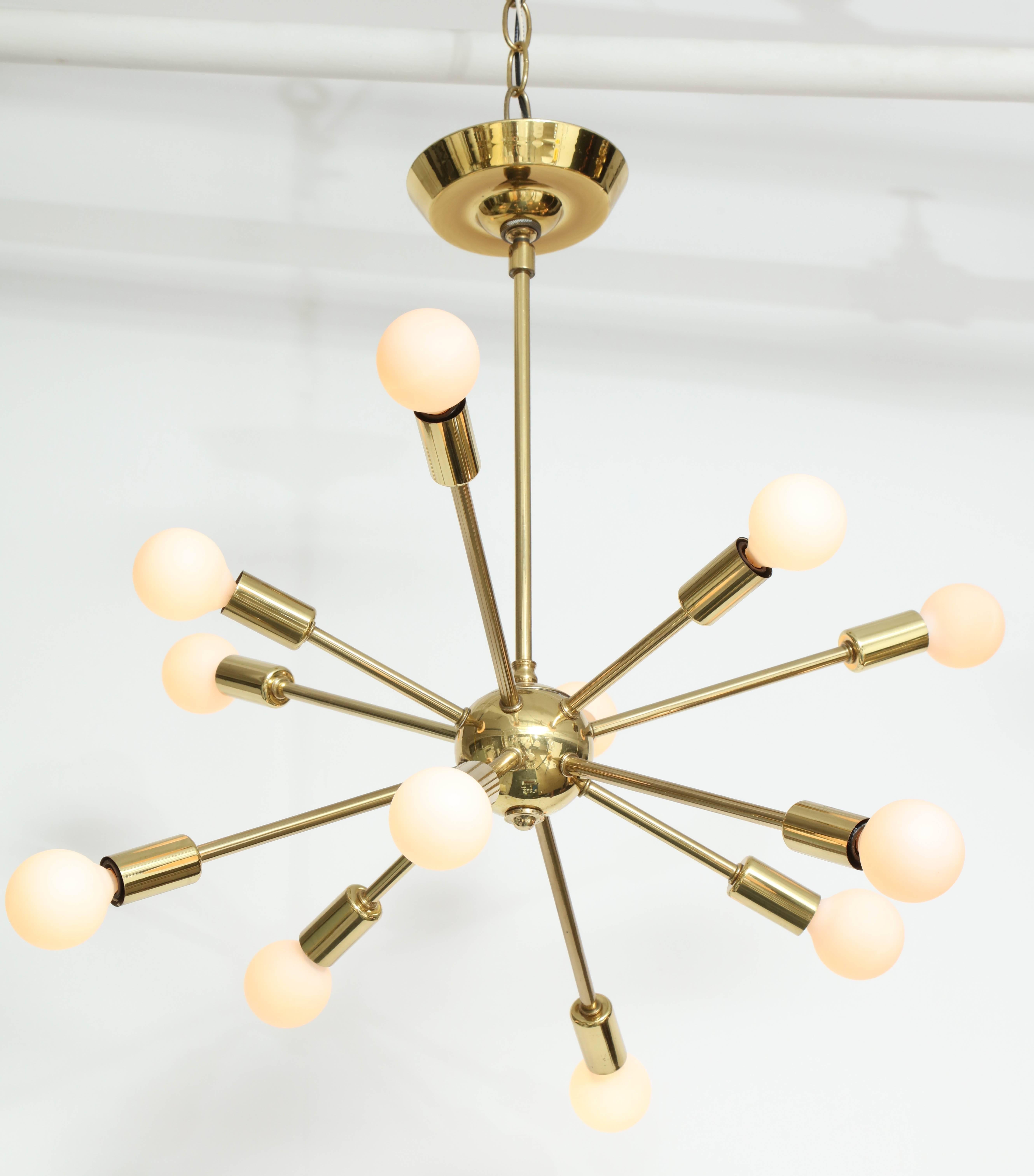 Majestic Lamp Company of New York's brass 10 arm sputnik with brass sphere made circa 1960s. This piece retains it's original label on the brass canopy. 

The Majestic Lamp Company was formed out of two other companies; the Grigsby-Grunow Company