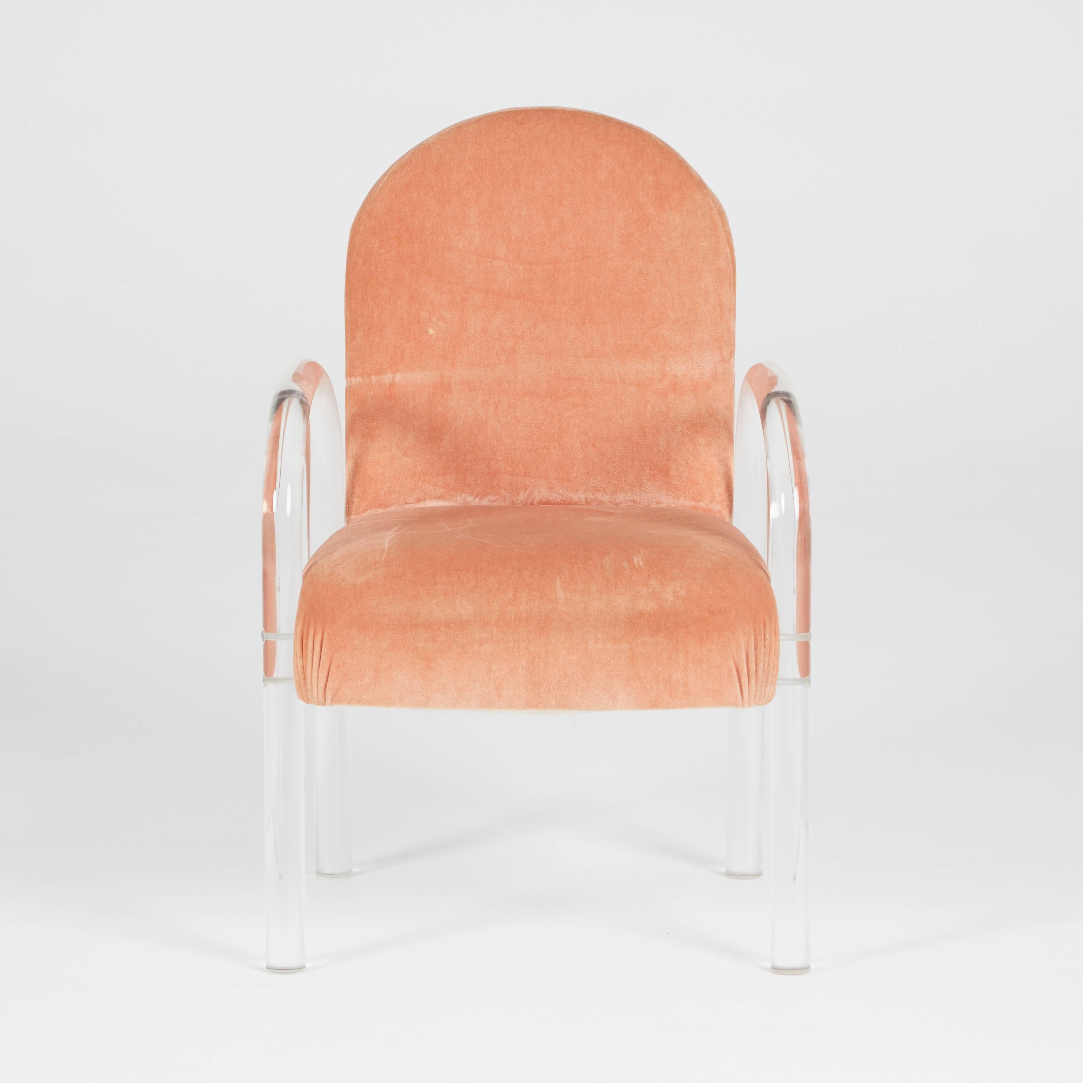 An incredible set of pink velvet and Lucite armchairs with original fabric and Lucite frames. In immaculate condition for its age, the Lucite frames look almost brand new and the fabric is clean and free of major blemishes. We believe the original