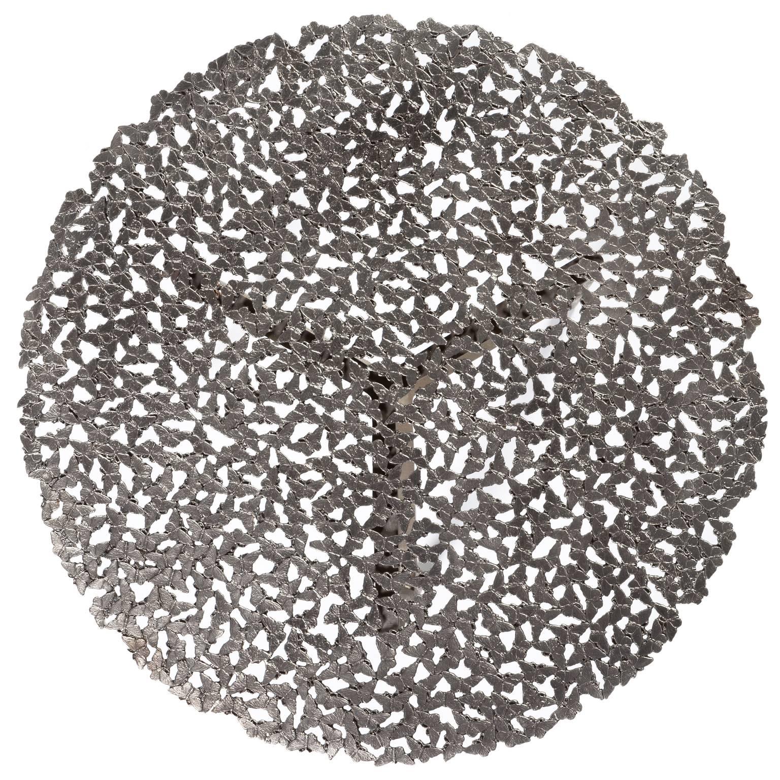A swarm of butterflies as delicate as a lace table cloth forms an everlasting tabletop in white bronze, lost wax cast by Italian master craftsmen. A sculptural table for both indoor and outdoor use.

This listing is for the white bronze version, for