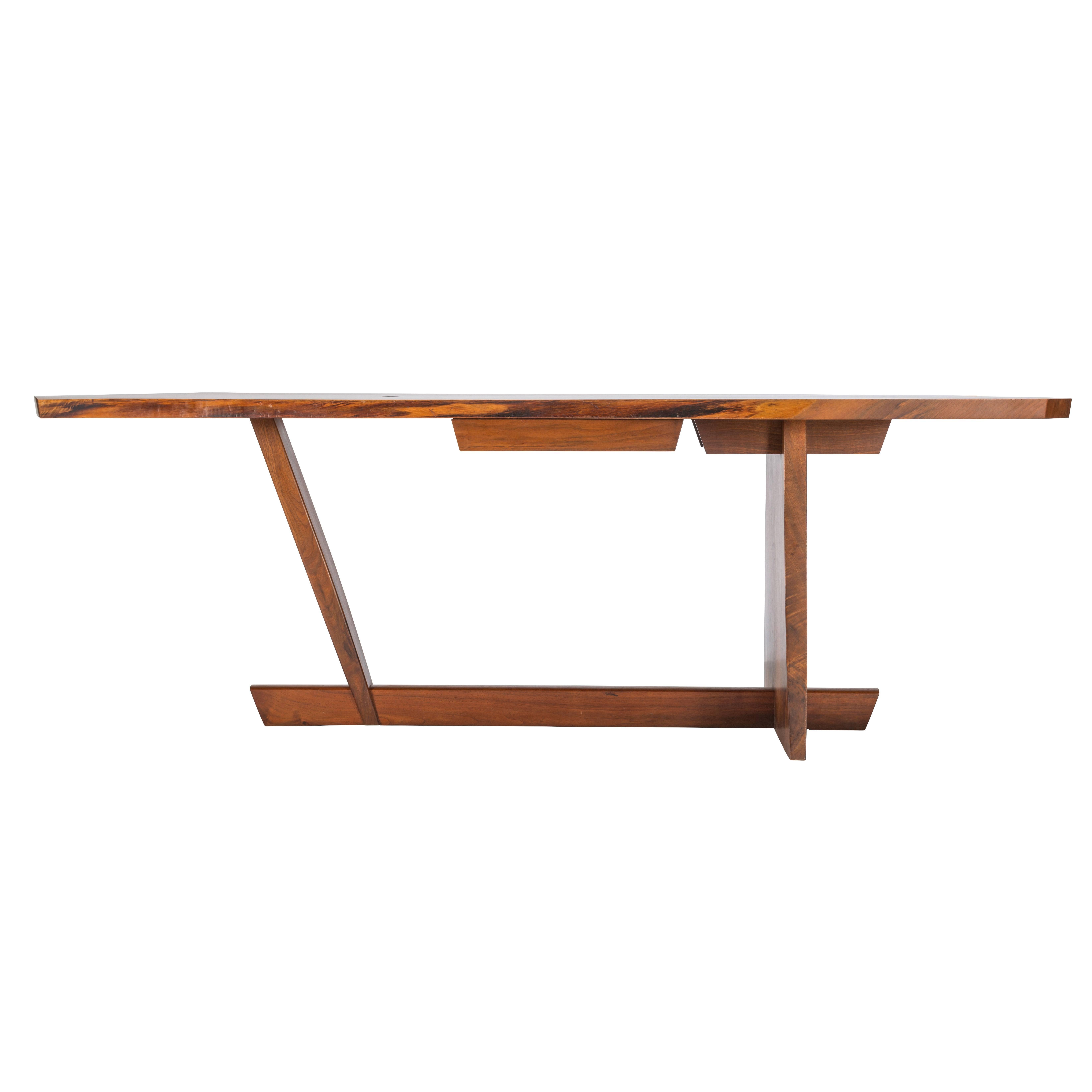 A true masterwork by George Nakashima. Exceptionally scaled 7ft Conoid desk with a single drawer. Each board was specially hand picked. Each expressive grained board is exceptional and used throughout the desks construction. Desk is signed and dated